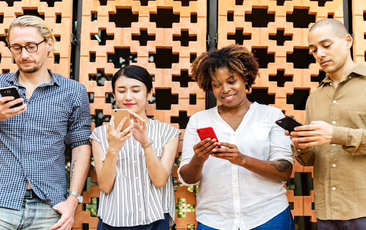 Four people reading their phones.